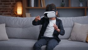 African American child boy kid son playing VR game at home play online 3d gaming with virtual reality glasses augmented headset AR technology gaming playing metaverse pretending fighting innovation - Powered by Shutterstock - Get 15% off with code: PIKWIZARD15