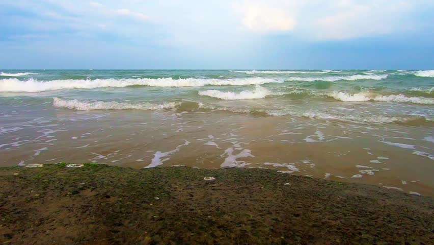 Admiring sea waves on rock on cloudy day. Observer POV, Static