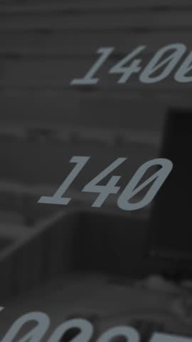 Animation of multiple numbers changing over computer and empty university room. counting and mathematics concept digitally generated video.