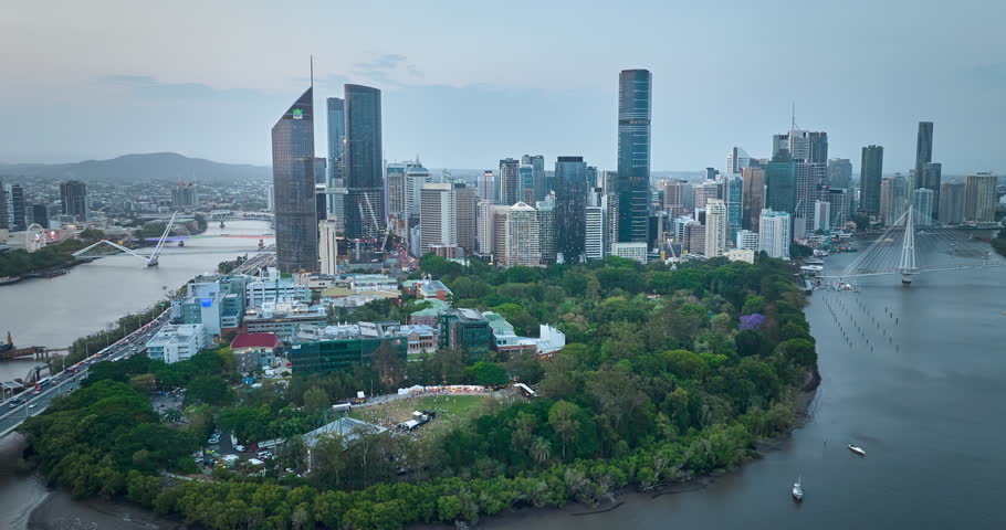 4K locked off stationary Drone Day to Night Time Lapse  motion view of Brisbane Central Business District with both sides of the Brisbane river in view, Brisbane, Queensland, Australia