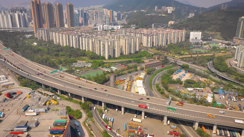 day time hong kong cityscape traffic road interchange aerial panorama 4k
