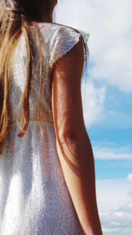 Animation of red heart balloons floating over mid section of couple in love holding hands and walking. Happy Valentines Day celebration concept digitally generated image.