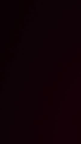 Animation of medal with gold number two and red ribbon and confetti floating on black background. Achievement and celebration concept digitally generated video.