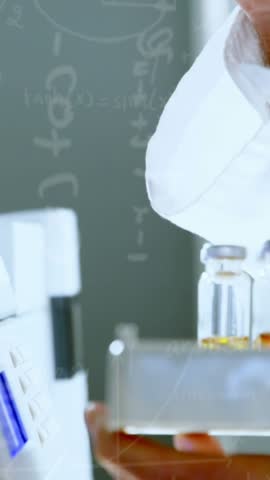 Animation of chemical formulas over hands of caucasian male lab worker with sample. science, chemistry and medicine concept digitally generated video.