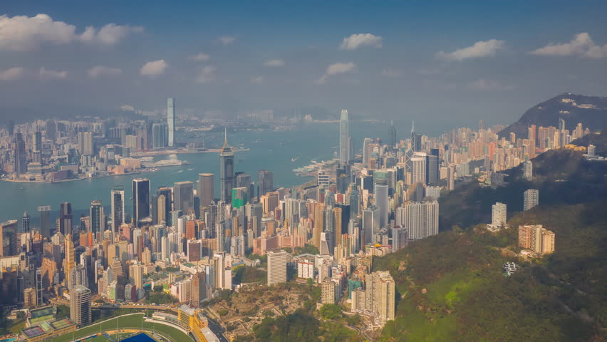 flight over hong kong city downtown victoria harbor sunny day aerial panorama 4k timelapse