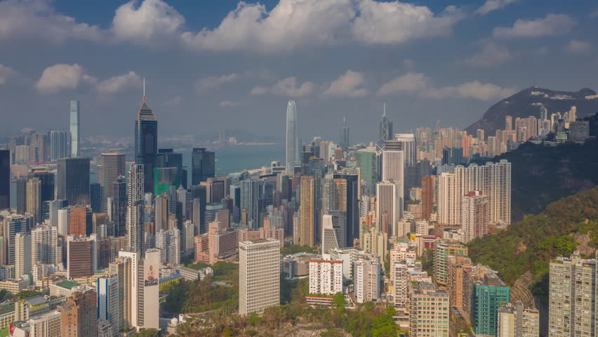 flight over hong kong city downtown victoria harbor sunny day aerial panorama 4k timelapse