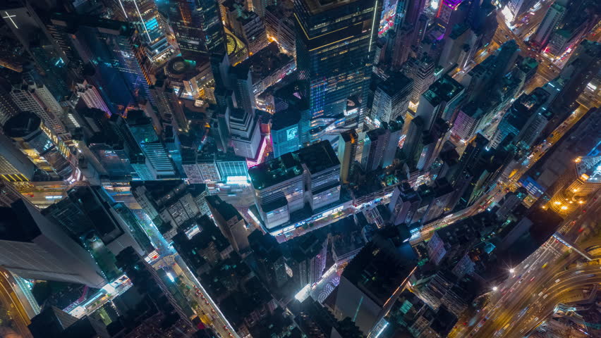night illumination flight over hong kong city downtown traffic interchange aerial topdown panorama 4k timelapse