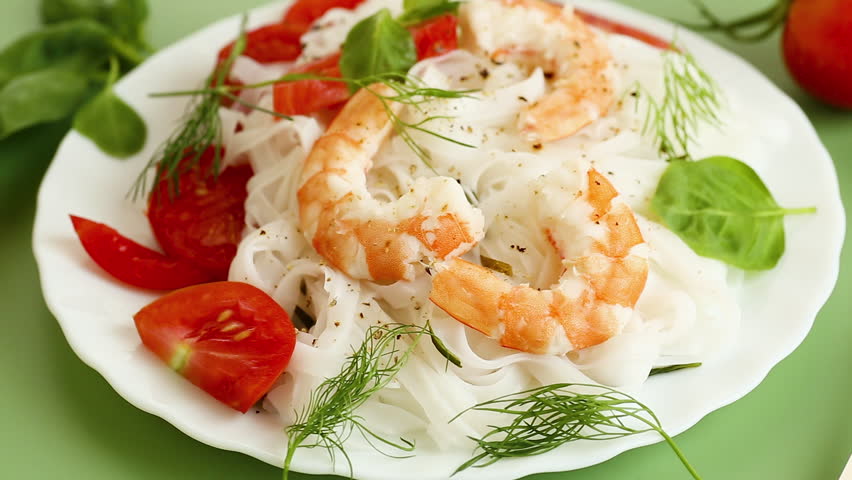 delicious seafood dinner, rice noodles with shrimp and basil
