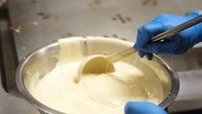 Chef pouring pancake batter into frying pan on gas stove - Powered by Shutterstock - Get 15% off with code: PIKWIZARD15
