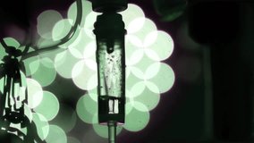In the operating room, an IV drip is slowly dripping medication in slow motion. - Powered by Shutterstock - Get 15% off with code: PIKWIZARD15