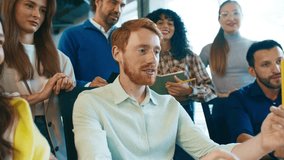 Team gathered around desk actively discussing best way to solve problem. People sharing ideas, taking notes, and debating solutions while collaborating at computer in modern office. - Powered by Shutterstock - Get 15% off with code: PIKWIZARD15