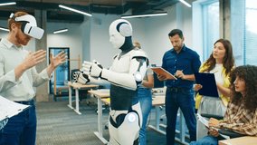 Man wearing VR headset interacting with humanoid robot. Group of colleagues writing observations and analyzing project performance. Focused team testing robotics development in technology workspace. - Powered by Shutterstock - Get 15% off with code: PIKWIZARD15