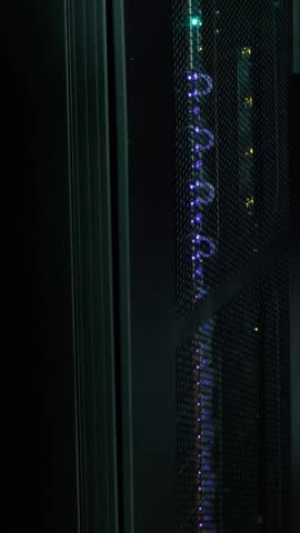 Animation of computer programming language over data server room. Digital composite, multiple exposure, communication, coding, network security, data center, networking, technology and network server.