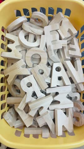Vertical. Early learning background with letters and alphabet materials. Concept of childhood education, literacy, and preschool development. User generated content