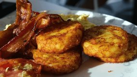 bacon, tomato, potato pancakes fried in bacon Potato hash browns, a meal with onions, cabbage in the form of fritters. Vegetable healthy breakfast - Powered by Shutterstock - Get 15% off with code: PIKWIZARD15