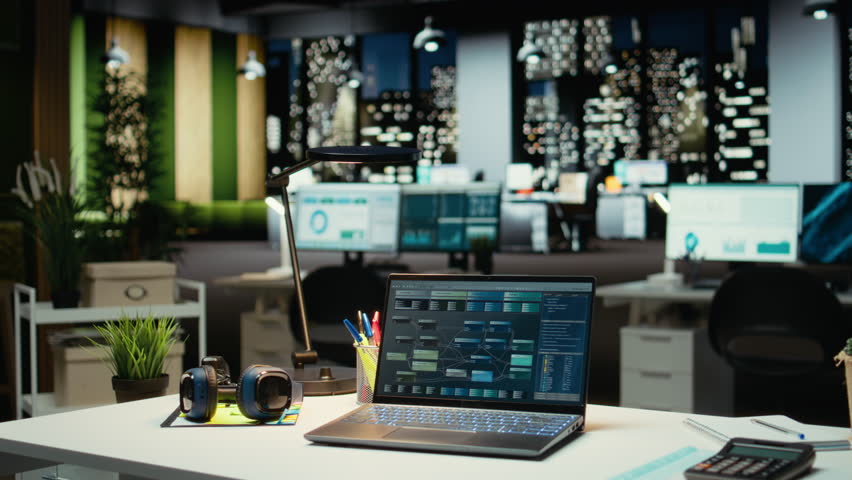 Professional empty office features computers and forecasting equipment. Modern space set for corporate planning, analytics and performance indicators that drive organizational success.