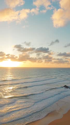 Majestic sunset over the Twelve Apostles along the Great Ocean Road, Victoria, Australia. Scenic limestone cliffs, soft waves, and pastel skies create a breathtaking coastal landscape perfect