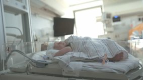 Newborn baby sleeping in incubator in neonatal hospital room - Powered by Shutterstock - Get 15% off with code: PIKWIZARD15