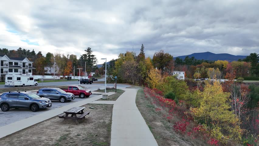 Conway, New Hampshire. 10-25-2025. Aerial view of showcasing charming townscape, forested hills, and scenic roads—capturing the essence of New England beauty.