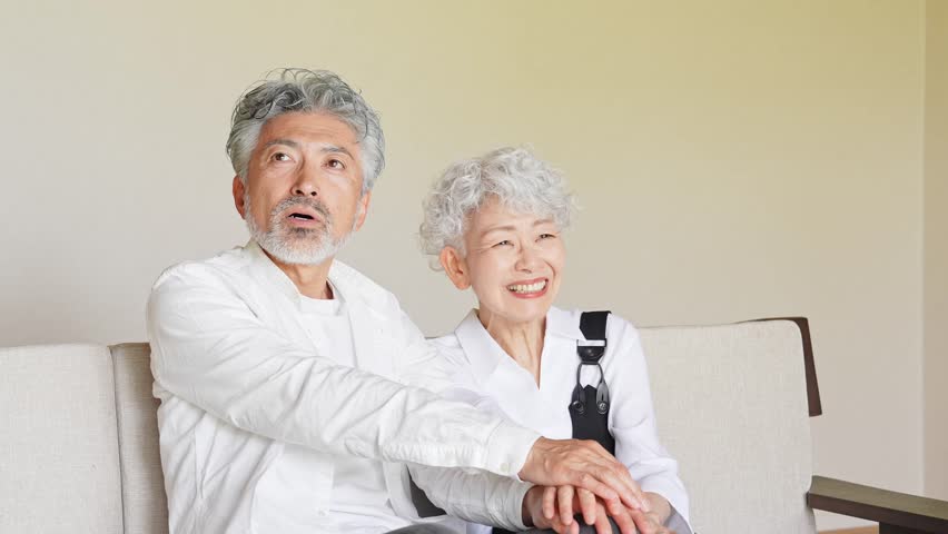Smiling senior couple holding hands