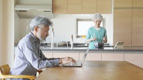 Senior couple relaxing in the dining room - Powered by Shutterstock - Get 15% off with code: PIKWIZARD15