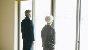 Senior couple relaxing by the window - Powered by Shutterstock - Get 15% off with code: PIKWIZARD15