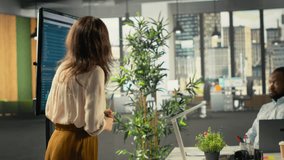 Diverse colleagues and managers participating in a partnership briefing. Business meeting focuses on negotiation, reporting and resource allocation for corporate development and success. Camera B. - Powered by Shutterstock - Get 15% off with code: PIKWIZARD15