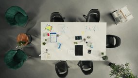 Top down view of doctors and nurses in meeting discussing treatment strategies and diagnosis plans. Diverse healthcare team collaborates on innovation and patient care solutions in office. Camera A. - Powered by Shutterstock - Get 15% off with code: PIKWIZARD15