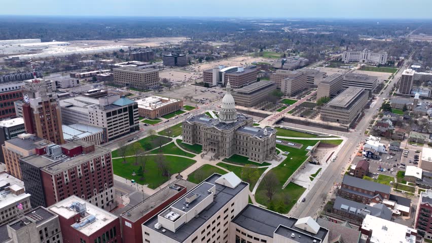 Michigan State Capitol aerial view at the end of Michigan Avenue with Boji Tower, Lansing, Michigan MI, USA. 