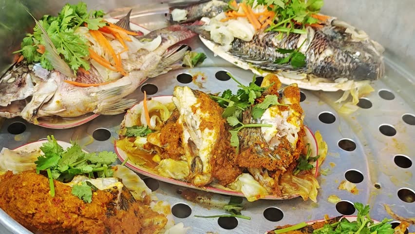 Steamed fish with herbs in a restaurant