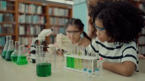 Elementary school students engaged in a science lesson, actively using experiment tools and equipment in the classroom for hands-on learning and education - Powered by Shutterstock - Get 15% off with code: PIKWIZARD15