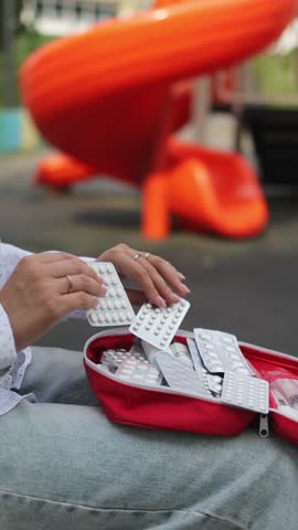 First aid kit. Children's playground. Slow motion video. Vertical video. High quality 4k footage