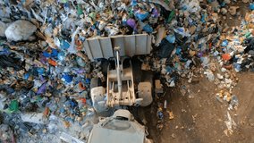 Slow-motion footage of a garbage truck unloading waste at a sorting plant. Concept of recycling, waste management, sustainability, and environmental protection. - Powered by Shutterstock - Get 15% off with code: PIKWIZARD15