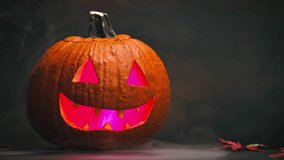 Creepy Halloween Pumpkin with Glowing Red Eyes and Smoke on black background - Powered by Shutterstock - Get 15% off with code: PIKWIZARD15