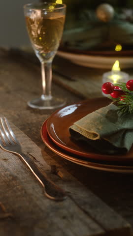 Vertical video. Table setting for Christmas dinner. Seasonal festive table decoration.
