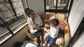 Child psychologist using sign language with young patient - Powered by Shutterstock - Get 15% off with code: PIKWIZARD15