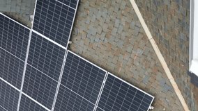 Aerial view of residential solar panels on house rooftop.Vertical video - Powered by Shutterstock - Get 15% off with code: PIKWIZARD15