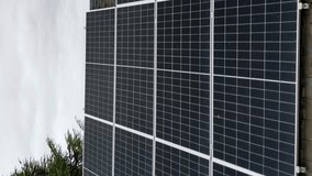 Aerial view of residential solar panels on house rooftop.Vertical video - Powered by Shutterstock - Get 15% off with code: PIKWIZARD15