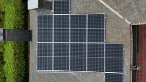 Aerial view of residential solar panels on house rooftop.Vertical video

 - Powered by Shutterstock - Get 15% off with code: PIKWIZARD15
