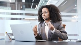 Angry african american businesswoman in a headset arguing talking on a video call on a laptop at workplace in office. Frustrated female manager solving stressful business situation or conflict resolut - Powered by Shutterstock - Get 15% off with code: PIKWIZARD15