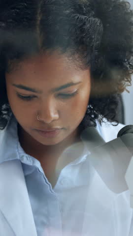 Scientist, research or woman in lab with microscope for sample analysis, biotech or cell inspection. Bokeh, person or science expert with equipment, medical innovation or cure development for cancer.