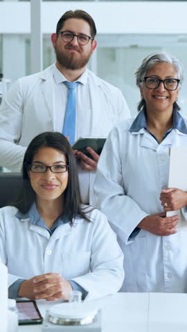 People, team and face at laboratory with scientist, pride and excited for innovation with medical research. Women, men and group with confidence, tech and smile in portrait for pharmaceutical study