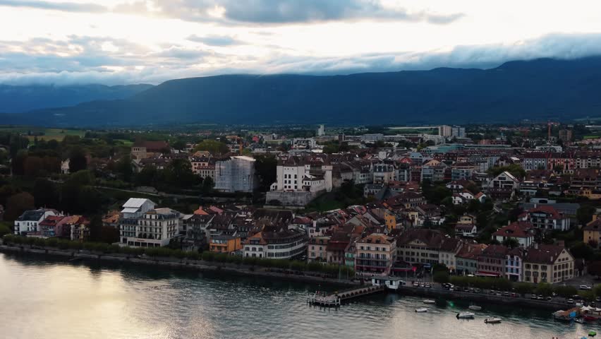 Aerial view of Nyon Castle, with its white stone walls contrasting against the city