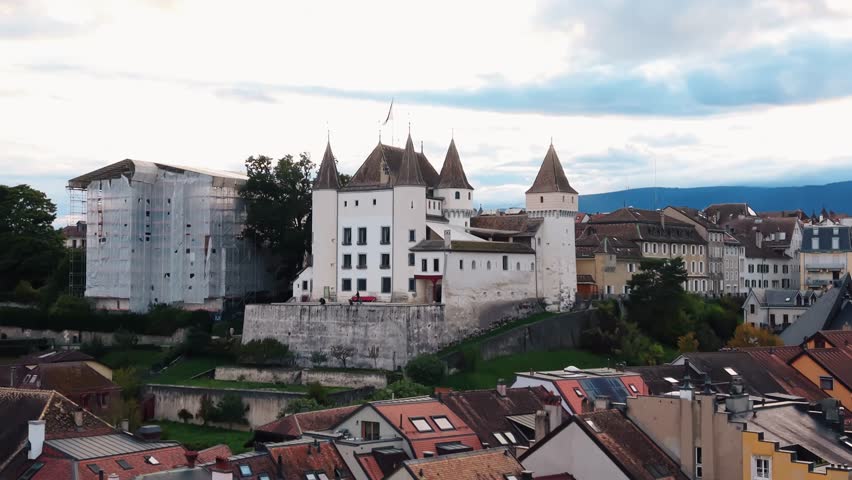 Aerial view of the majestic Nyon Castle standing tall amidst the charming town with its unique architecture, Nyon, Vaud, Switzerland.
