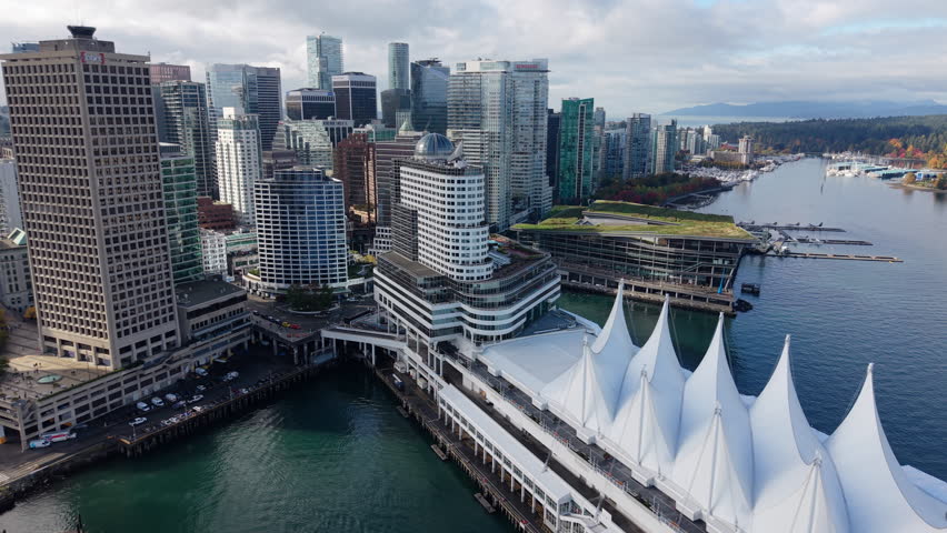 Aerial Push-In to Vancouver Convention Centre - framed by Canada Place and Stanley Park