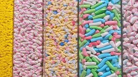 Colorful candies displayed in a sweet shop, neatly arranged in transparent containers. Bright pastel sweets symbolizing sugar, confectionery, and sugar-free treat concepts. - Powered by Shutterstock - Get 15% off with code: PIKWIZARD15