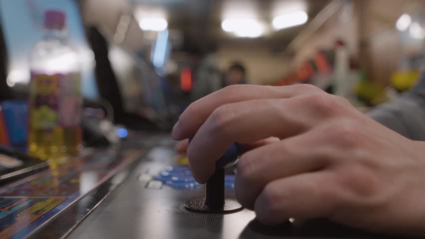 Close up of a male hand using a arcade fight stick, Japan - Powered by Shutterstock - Get 15% off with code: PIKWIZARD15