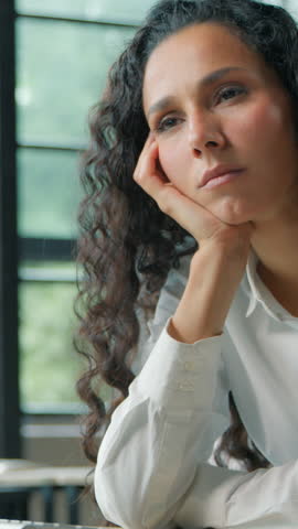 Stressed exhausted Hispanic business woman in office businesswoman ethnic female girl worker tired sleepy lazy bored with online computer job task overworked bad feeling fatigued health problem ill