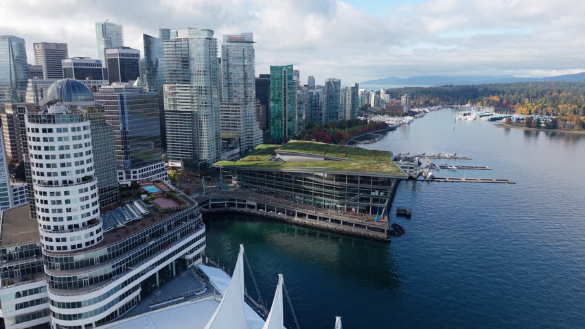 Aerial Push-In to Vancouver Convention Centre with Stanley Park Behind