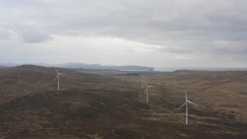 Wind farm in Scotland with turbines for electrical energy generation - Wind farm, power station for clean energy production from wind - Renewable energy and environment concepts